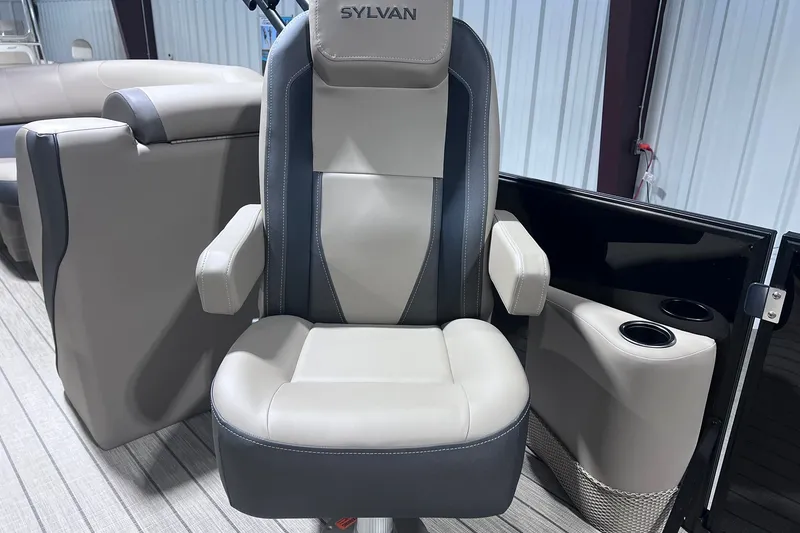 Slide: The Image of 2026 Sylvan X3 boat seat with armrests and cup holders in a modern interior. - 11