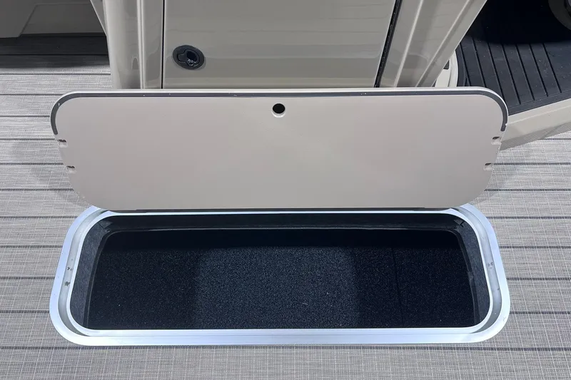 Slide: The Image of Open storage compartment on 2026 Sylvan X3 boat deck. - 30