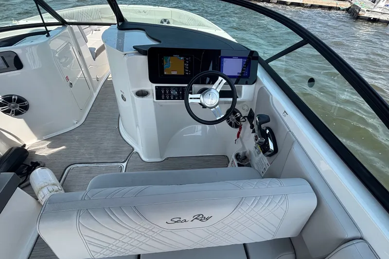 Slide: The Image of 2025 Sea Ray SDX 250 Outboard boat interior with modern dashboard and steering wheel. - 7