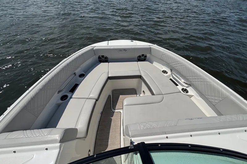 Slide: The Image of 2025 Sea Ray SDX 250 Outboard boat with spacious seating on calm water. - 5