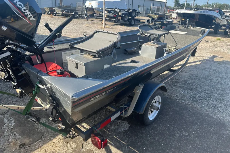 Slide: The Image of 1991 Grumman Rouge 150 T boat with Mercury outboard motor on trailer. - 12