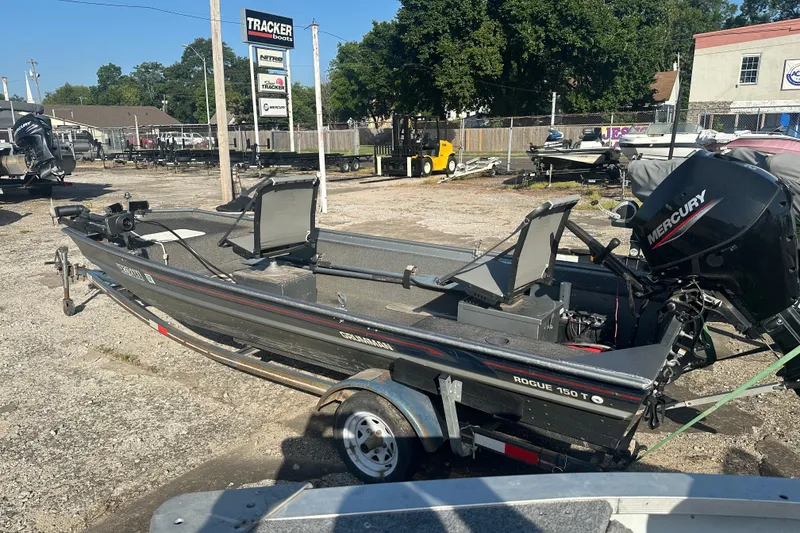 Slide: The Image of 1991 Grumman Rouge 150 T boat with Mercury engine on trailer in outdoor lot. - 3