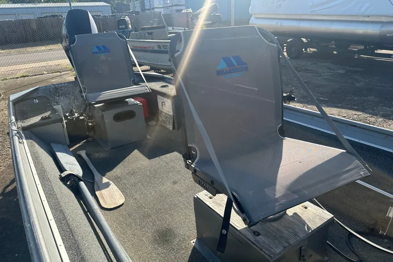 Slide: The Image of 1991 Grumman Rouge 150 T boat interior with Millennium Marine seats and paddles. - 14
