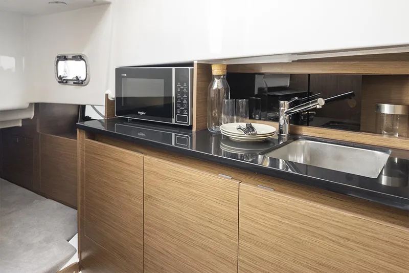 Slide: The Image of Manufacturer Provided Image: Modern kitchen area in 2026 Beneteau Flyer 9 SUNdeck with microwave and sink. - 5