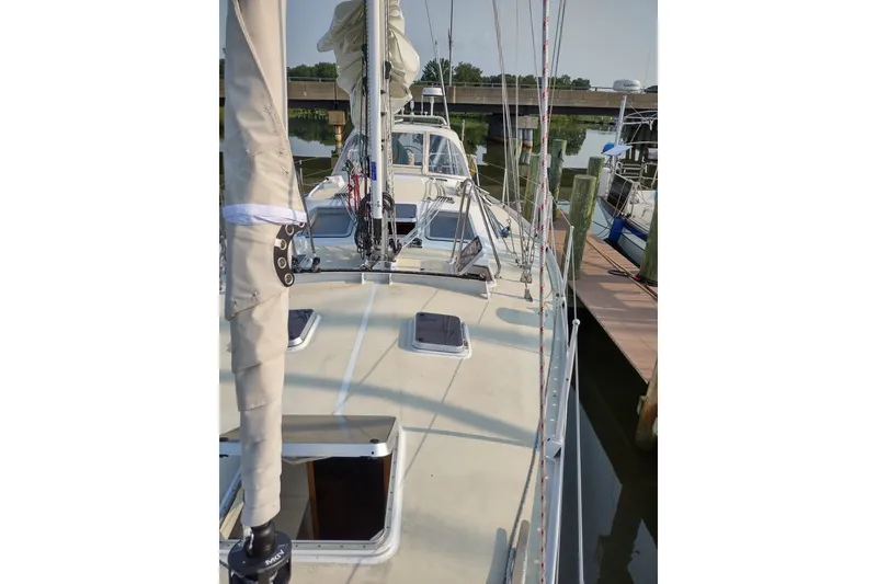Slide: The Image of Sailboat Garcia Passoa 47, 2005 model, docked at a marina with visible deck and rigging. - 53