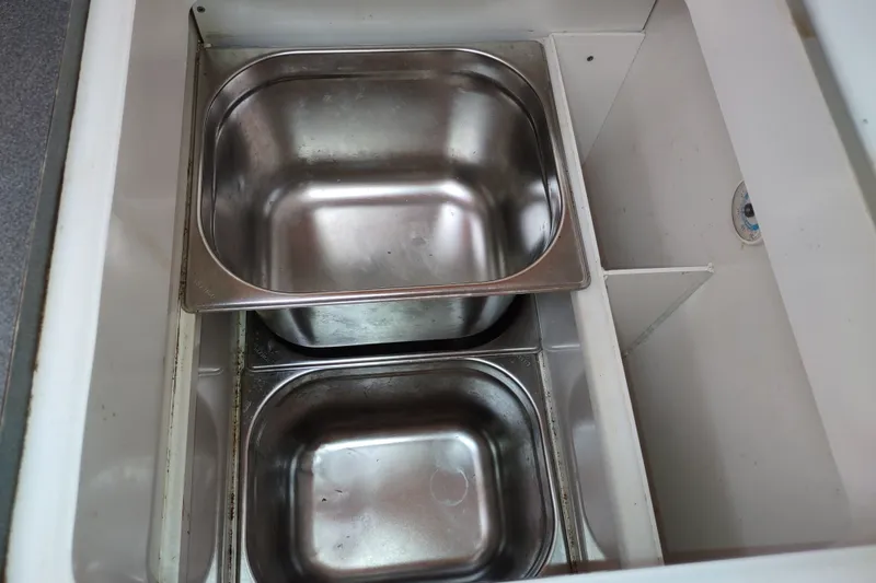 Slide: The Image of Stainless steel sinks in a 2005 Garcia Passoa 47 yacht kitchen. - 78