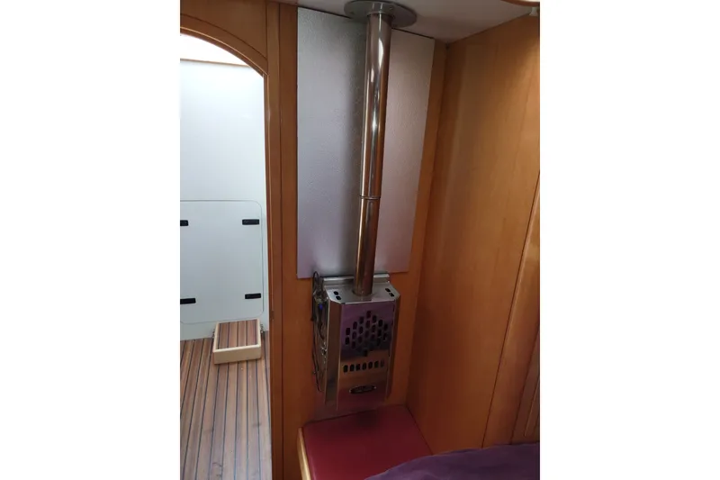 Slide: The Image of Interior of 2005 Garcia Passoa 47 yacht with a sleek metal heater. - 29