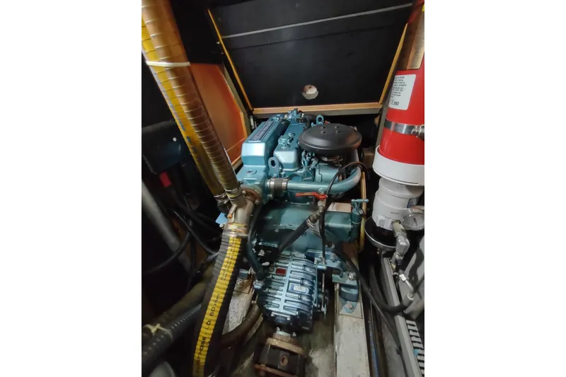 Slide: The Image of Engine compartment of a 2005 Garcia Passoa 47 sailboat, featuring detailed mechanical components. - 70