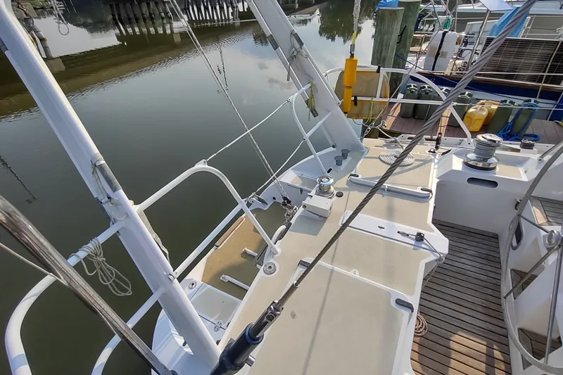 Slide: The Image of Deck view of 2005 Garcia Passoa 47 sailboat docked at marina. - 60