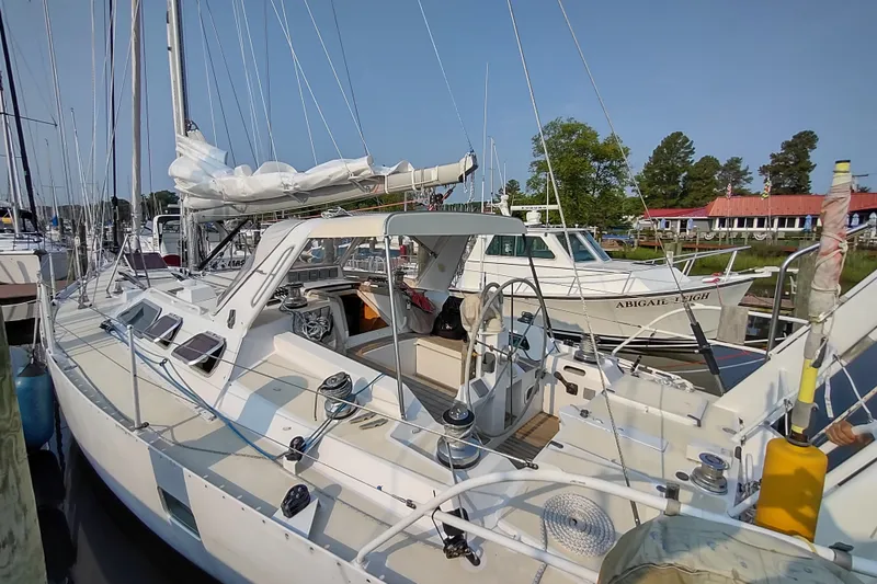 Slide: The Image of Sailboat Garcia Passoa 47, 2005 model, docked at marina with clear sky. - 47