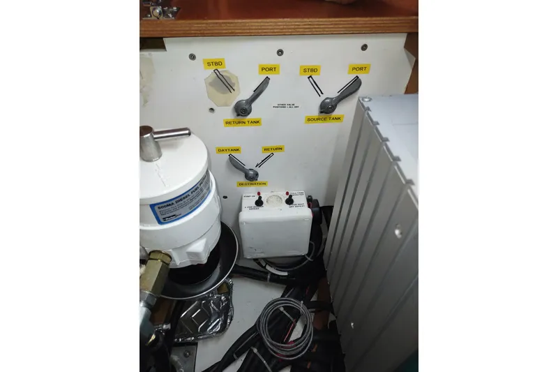 Slide: The Image of Engine control panel of a 2005 Garcia Passoa 47 yacht with labeled levers and components. - 79