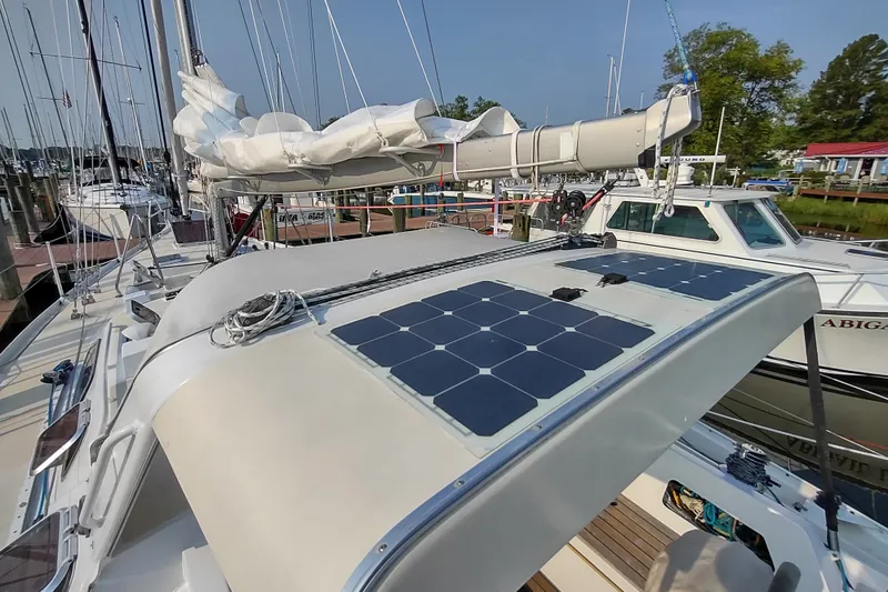 Slide: The Image of Sailboat Garcia Passoa 47 (2005) with solar panels docked at marina. - 48
