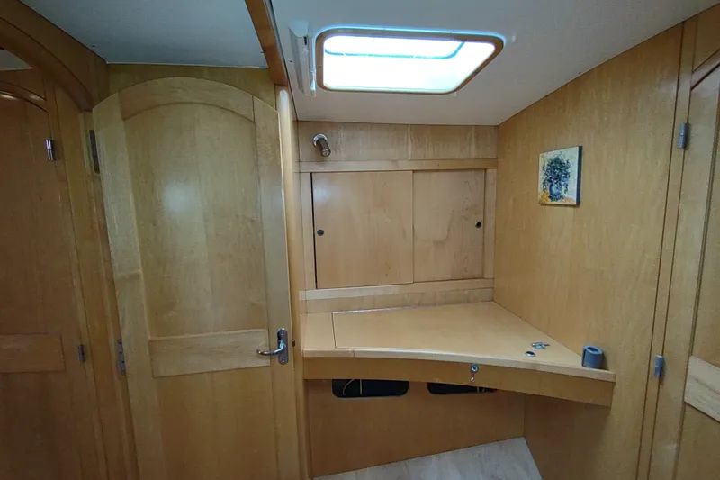 Slide: The Image of Interior of 2005 Garcia Passoa 47 yacht with wooden cabinetry and skylight. - 31
