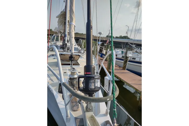 Slide: The Image of Sailboat Garcia Passoa 47, 2005 model, docked at marina with visible rigging and equipment. - 44