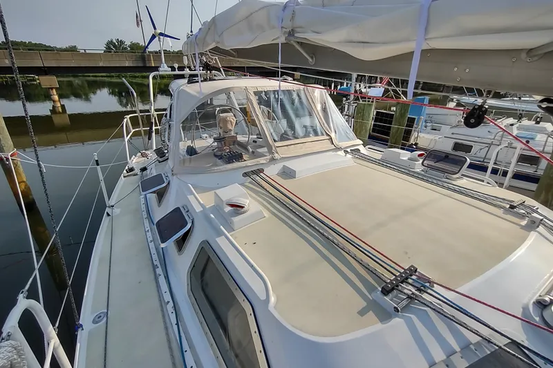 Slide: The Image of 2005 Garcia Passoa 47 sailboat docked, showcasing deck and rigging details. - 57