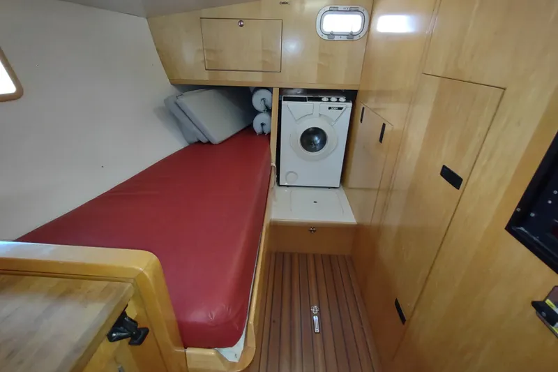 Slide: The Image of Interior of 2005 Garcia Passoa 47 yacht with bed and washing machine. - 19