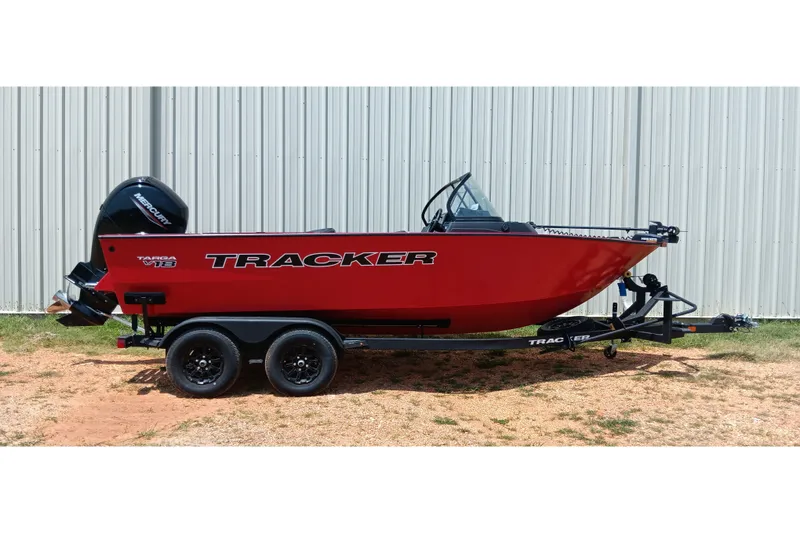 The Image of 2026 Tracker Targa V-18 Combo boat on trailer, red exterior, parked outdoors. - 0