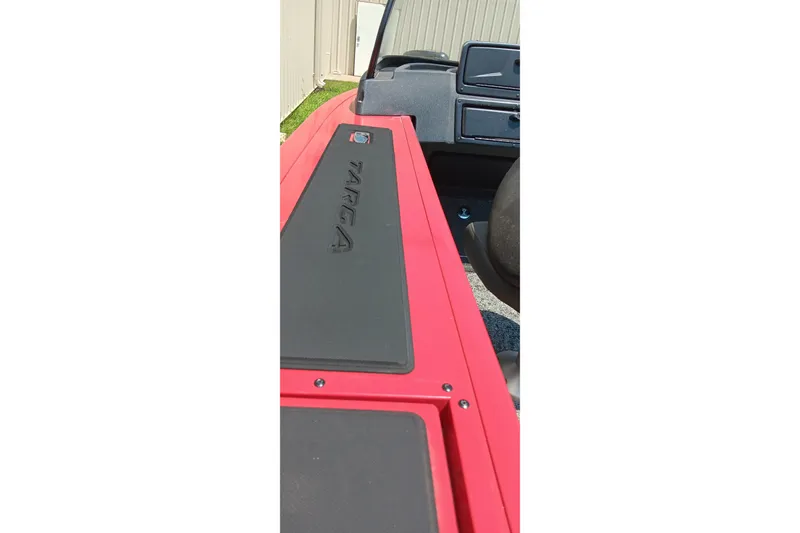 Slide: The Image of 2026 Tracker Targa V-18 Combo boat interior with red and black detailing. - 9