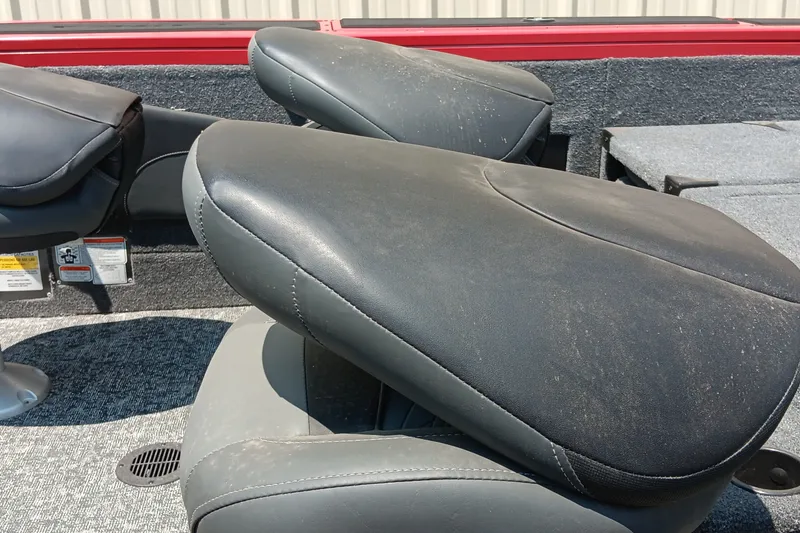 Slide: The Image of 2026 Tracker Targa V-18 Combo boat seats with gray upholstery and textured flooring. - 19