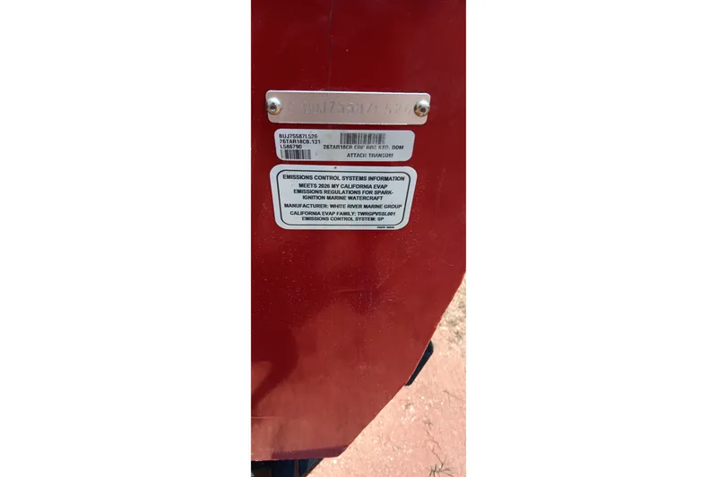 Slide: The Image of Close-up of emissions control label on 2026 Tracker Targa V-18 Combo boat. - 24