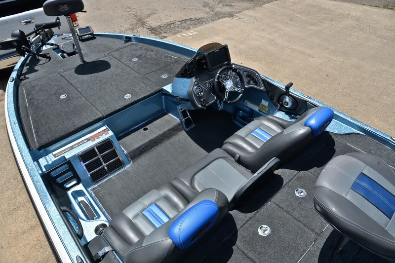 Slide: The Image of 2012 Ranger Z518 boat interior with dual seats, steering console, and spacious deck. - 21
