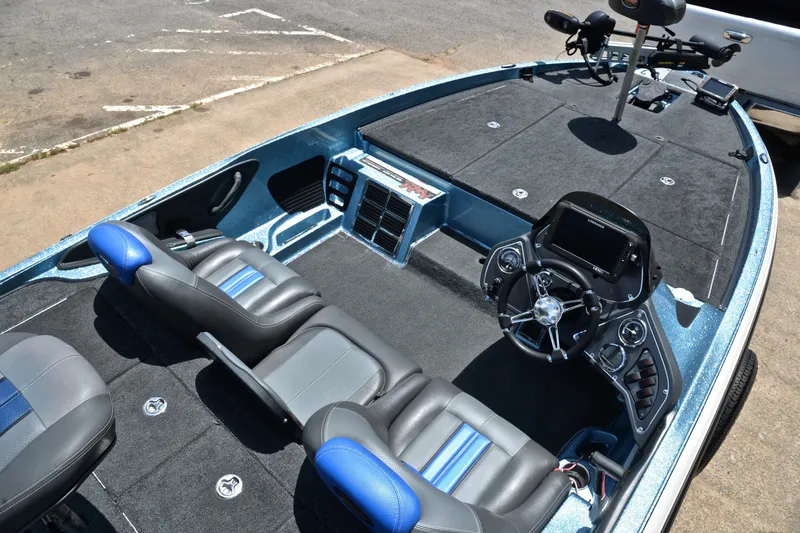 Slide: The Image of 2012 Ranger Z518 boat interior with dual seats, steering console, and fishing deck. - 20