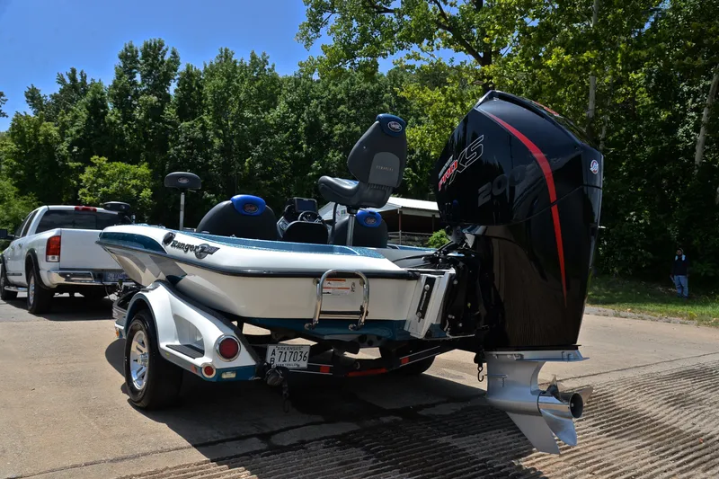 Slide: The Image of 2012 Ranger Z518 boat with powerful outboard motor on a trailer, ready for launch. - 12