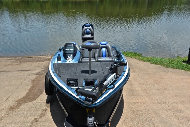 Slide: The Image of 2012 Ranger Z518 boat on a concrete ramp by a lake. - 17
