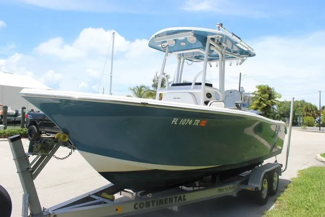 Slide: The Image of A 2023 Sea Pro 219 Center Console boat on a trailer, ready for the water. - 3