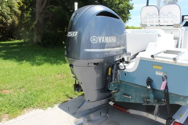 Slide: The Image of A Yamaha outboard motor on a Sea Pro 219 Center Console boat, parked on a lawn. - 10