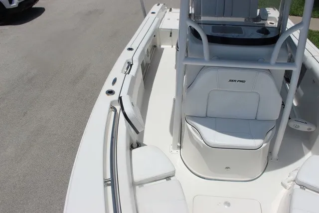 Slide: The Image of The image shows the deck of a 2023 Sea Pro 219 Center Console boat with white seating. - 31