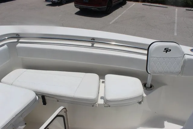 Slide: The Image of The 2023 Sea Pro 219 Center Console features a white bench seat with stainless steel railing. - 23