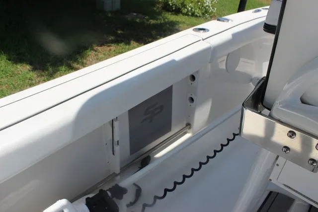 Slide: The Image of The image shows the cockpit of a 2023 Sea Pro 219 Center Console boat with white surfaces. - 49