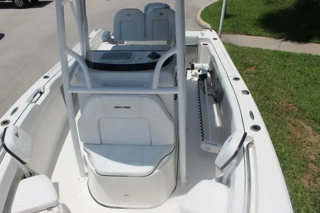 Slide: The Image of The image shows a 2023 Sea Pro 219 Center Console boat with white interior and seating. - 32