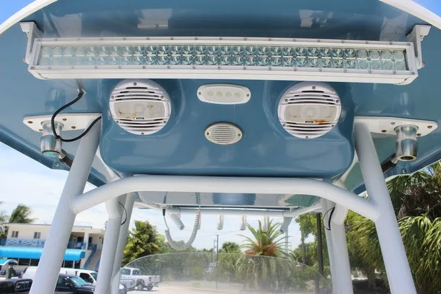 Slide: The Image of The image shows the roof of a Sea Pro 219 Center Console boat with speakers and lighting. - 37