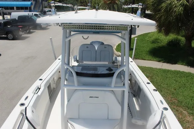 Slide: The Image of The image shows a 2023 Sea Pro 219 Center Console boat with a modern helm station. - 30