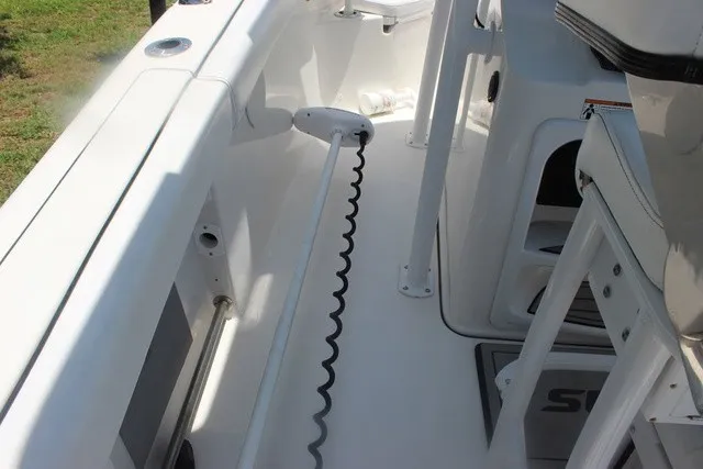 Slide: The Image of The image shows the cockpit of a 2023 Sea Pro 219 Center Console boat with white seating and a clean deck. - 50