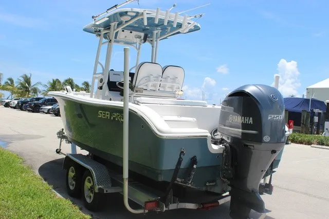 Slide: The Image of A 2023 Sea Pro 219 Center Console boat on a trailer, featuring a Yamaha 250 outboard motor. - 7