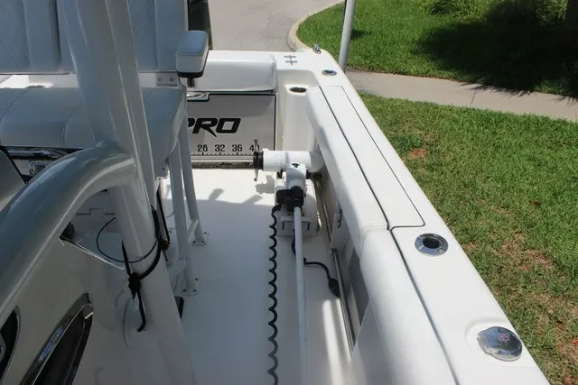 Slide: The Image of The image shows the deck of a 2023 Sea Pro 219 Center Console boat with a clean, white design. - 21