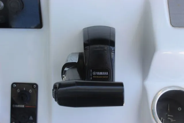 Slide: The Image of Close-up of a Yamaha throttle lever on a Sea Pro 219 Center Console boat. - 41