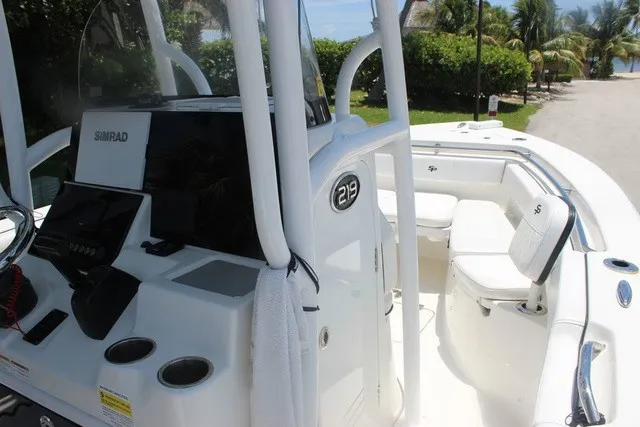 Slide: The Image of The image shows a 2023 Sea Pro 219 Center Console boat with a modern helm and seating area. - 18