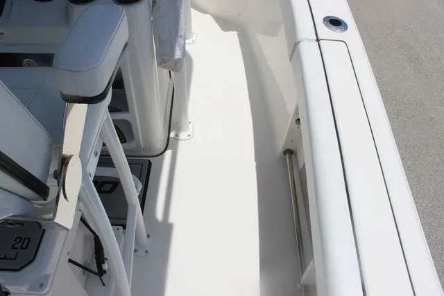 Slide: The Image of The image shows the deck of a 2023 Sea Pro 219 Center Console boat with white seating. - 48
