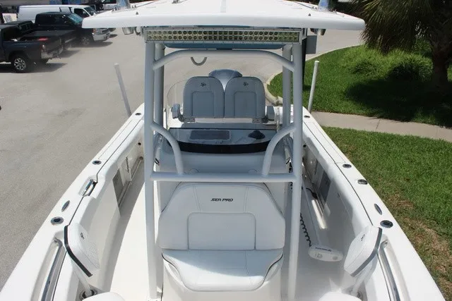 Slide: The Image of The image shows a 2023 Sea Pro 219 Center Console boat with a spacious deck and T-top. - 28