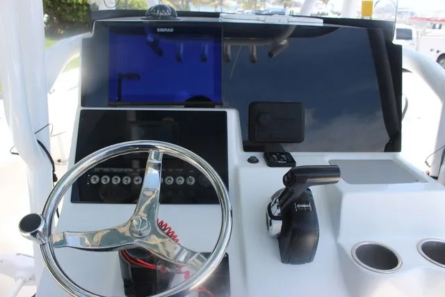 Slide: The Image of Helm of the 2023 Sea Pro 219 Center Console with steering wheel and controls. - 38