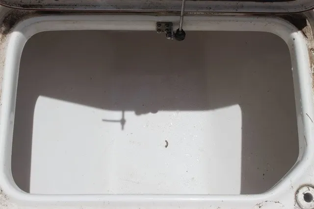 Slide: The Image of An empty storage compartment on a 2023 Sea Pro 219 Center Console boat. - 24