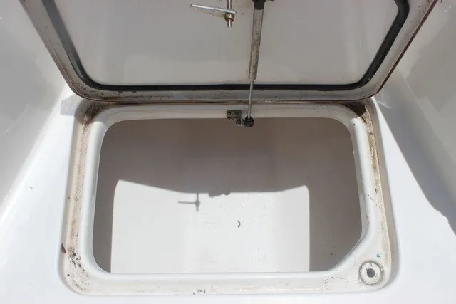 Slide: The Image of An open storage compartment on a 2023 Sea Pro 219 Center Console boat. - 25
