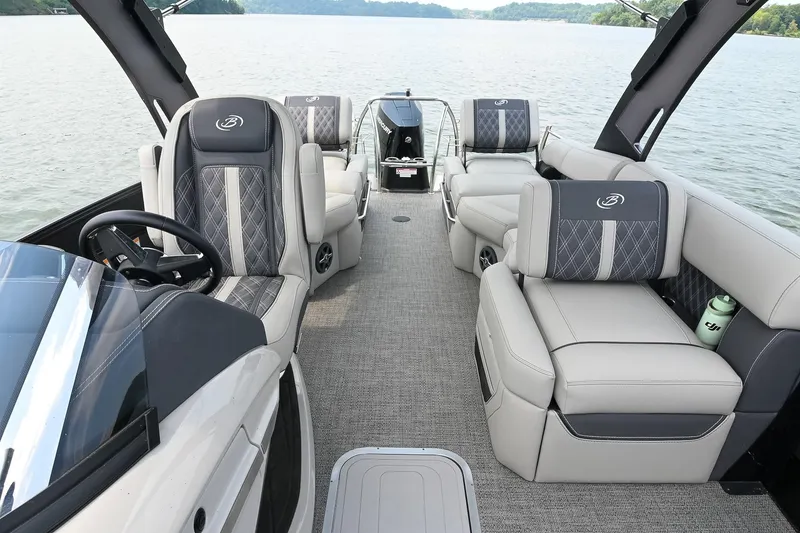 Slide: The Image of Luxurious interior of 2025 Barletta Lusso 25UCA pontoon boat on a serene lake. - 8