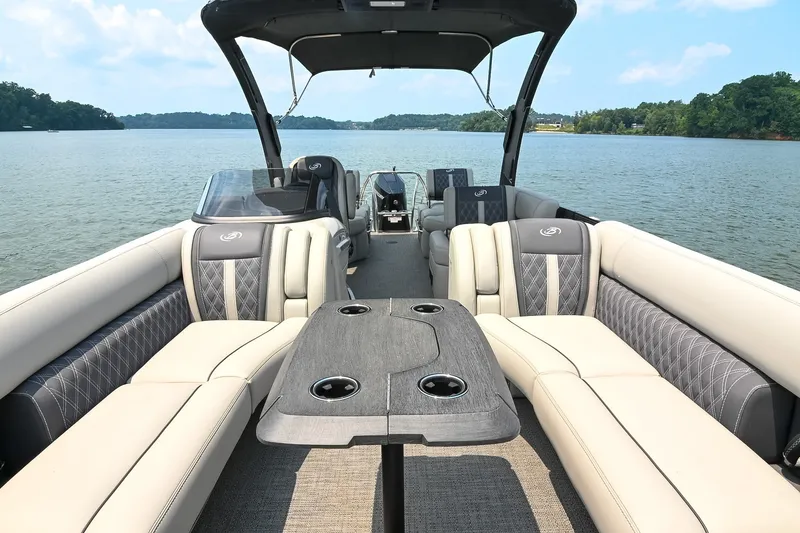 Slide: The Image of Luxurious 2025 Barletta Lusso 25UCA pontoon boat interior on a serene lake. - 6