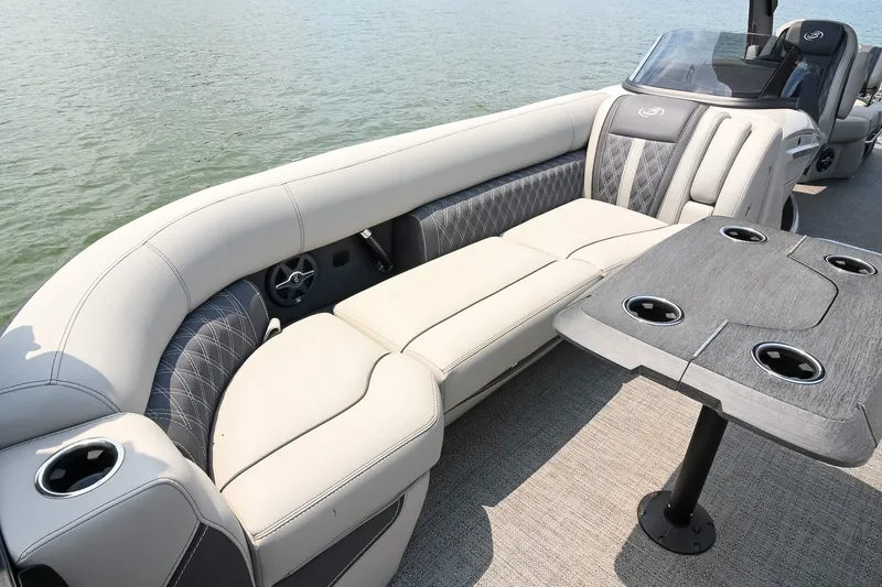 Slide: The Image of Luxurious 2025 Barletta Lusso 25UCA pontoon boat interior with plush seating and stylish table. - 14