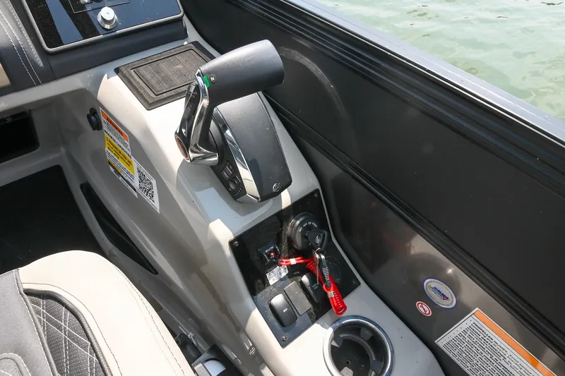 Slide: The Image of Control panel of 2025 Barletta Lusso 25UCA boat with throttle and ignition switch. - 28
